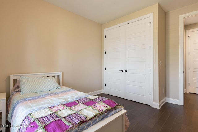 1911 Dressage Cir, Louisville, KY 40245 - bedroom with a closet, dark wood-style flooring, and baseboards