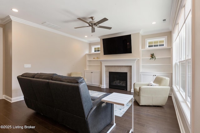 1911 Dressage Cir, Louisville, KY 40245 - living room featuring ceiling fan, dark wood finished floors, a tiled fireplace, crown molding, and recessed lighting