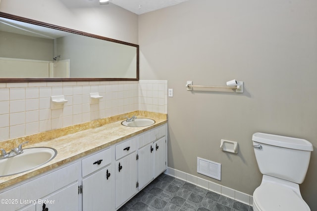 360 Pumpkin Rd, Shepherdsville, KY 40165 - full bathroom featuring double vanity, toilet, baseboards, tasteful backsplash, and tile patterned flooring