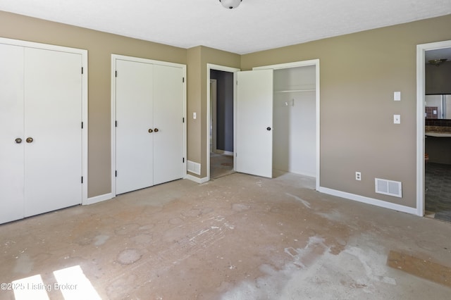 360 Pumpkin Rd, Shepherdsville, KY 40165 - unfurnished bedroom with two closets and baseboards