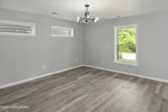 802 Kentucky Ave, Frankfort, KY 40601 - empty room with a chandelier, wood finished floors, and baseboards