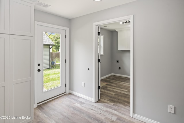 802 Kentucky Ave, Frankfort, KY 40601 - doorway featuring light wood-style flooring and baseboards