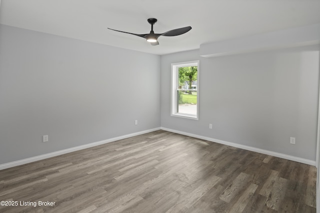 802 Kentucky Ave, Frankfort, KY 40601 - spare room featuring wood finished floors, a ceiling fan, and baseboards