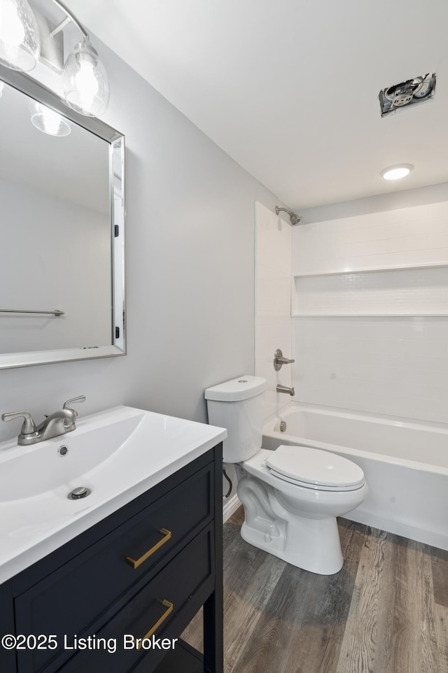 802 Kentucky Ave, Frankfort, KY 40601 - bathroom with toilet, vanity, wood finished floors, and bathing tub / shower combination