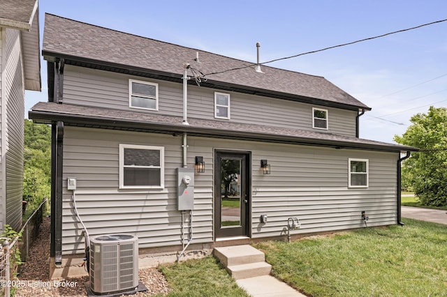 802 Kentucky Ave, Frankfort, KY 40601 - back of property with central air condition unit, a lawn, and a shingled roof