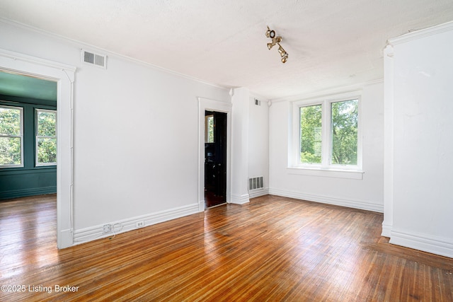 1337 S 1st St Unit 3R, Louisville, KY 40208 - spare room featuring wood finished floors, baseboards, and crown molding