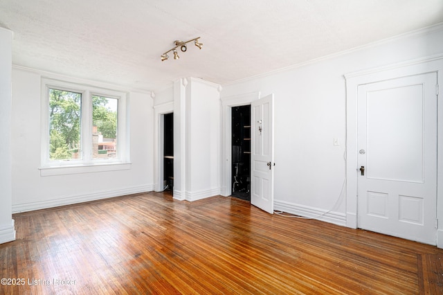 1337 S 1st St Unit 3R, Louisville, KY 40208 - unfurnished bedroom with baseboards, ornamental molding, and wood finished floors