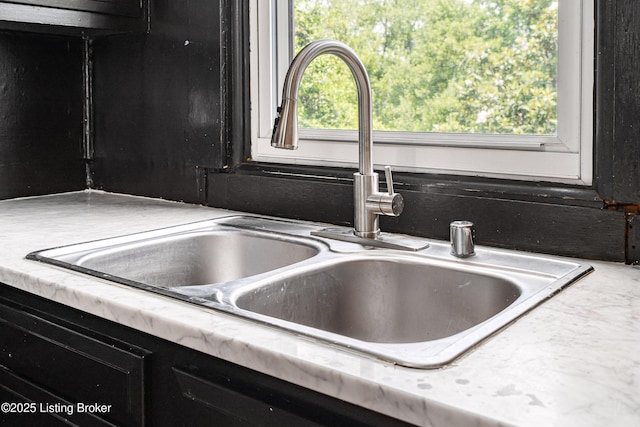 1337 S 1st St Unit 3R, Louisville, KY 40208 - kitchen view of a sink, dark cabinetry, and light countertops