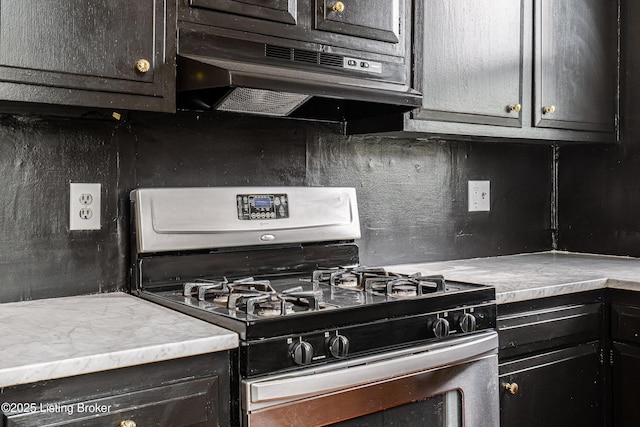 1337 S 1st St Unit 3R, Louisville, KY 40208 - kitchen featuring gas stove, backsplash, under cabinet range hood, and light countertops