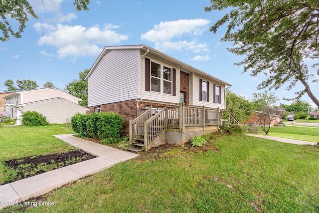 1000 Greenway Dr, Elizabethtown, KY 42701 - view of front of property featuring a front lawn, brick siding, and a wooden deck