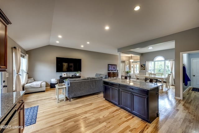 4605 Clarkhurst Cir, Smithfield, KY 40068 - kitchen with light wood-type flooring, open floor plan, light stone countertops, recessed lighting, and lofted ceiling