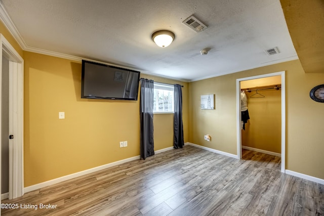 4605 Clarkhurst Cir, Smithfield, KY 40068 - unfurnished bedroom featuring ornamental molding, wood finished floors, a textured ceiling, baseboards, and a closet