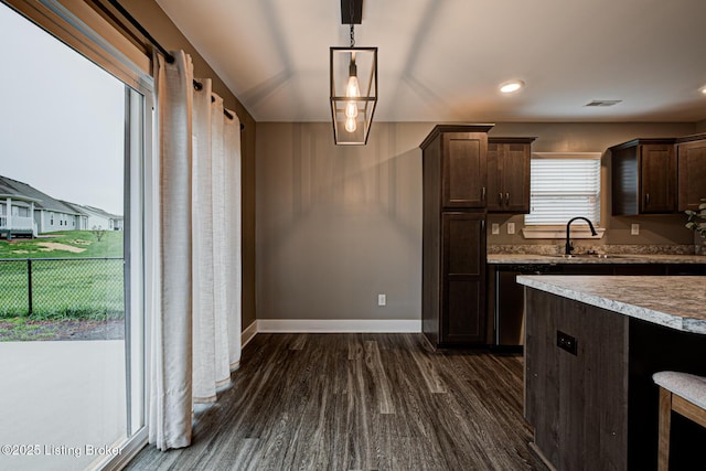 10938 Pheasant Hill Cir, Louisville, KY 40229 - kitchen featuring dark brown cabinets, a sink, dark wood-style flooring, baseboards, and pendant lighting