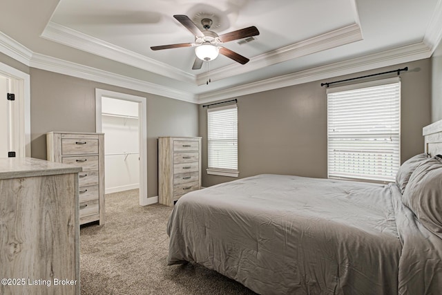 10938 Pheasant Hill Cir, Louisville, KY 40229 - bedroom with a tray ceiling, light colored carpet, a spacious closet, crown molding, and a ceiling fan