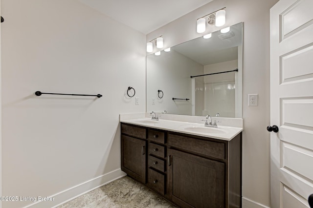 10938 Pheasant Hill Cir, Louisville, KY 40229 - bathroom featuring baseboards, double vanity, and a shower