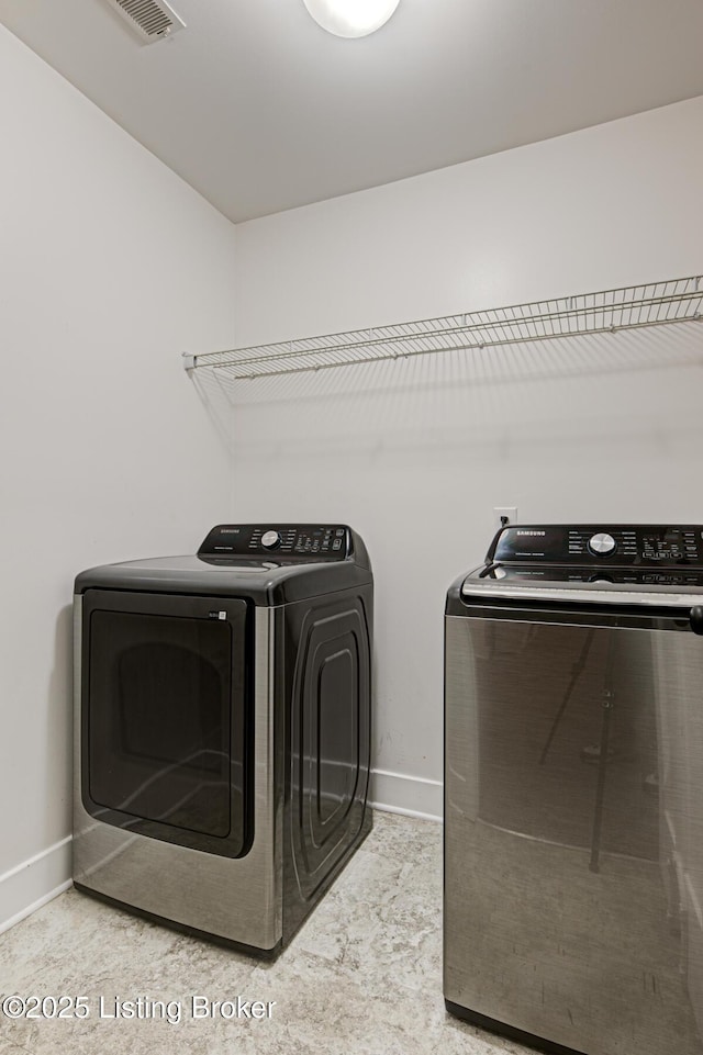 10938 Pheasant Hill Cir, Louisville, KY 40229 - laundry area with washer and dryer and baseboards