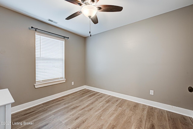 10938 Pheasant Hill Cir, Louisville, KY 40229 - spare room featuring a ceiling fan, wood finished floors, and baseboards