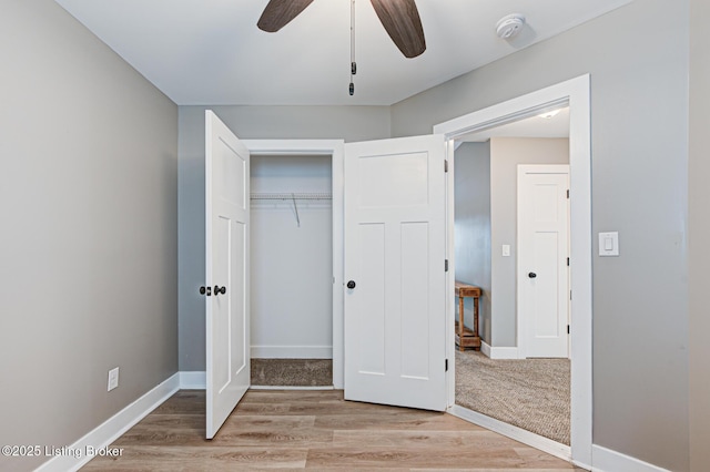 10938 Pheasant Hill Cir, Louisville, KY 40229 - unfurnished bedroom with light wood-style flooring, a closet, baseboards, and a ceiling fan