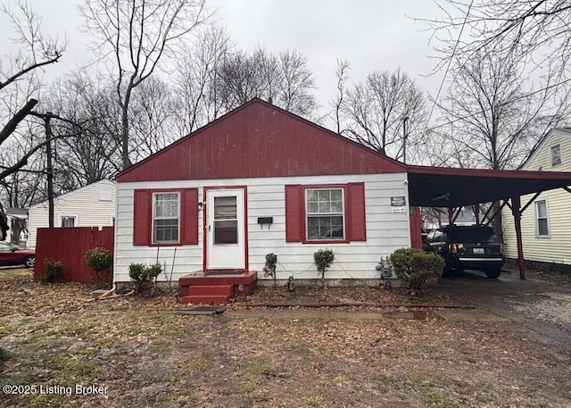 1625 Clara Ave, Louisville, KY 40215 - view of front of property with an attached carport and driveway