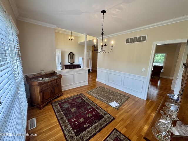 144 Woodhill Rd, Bardstown, KY 40004 - dining area featuring crown molding, a chandelier, light wood-type flooring, and a wainscoted wall