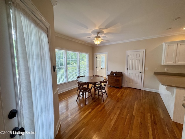 144 Woodhill Rd, Bardstown, KY 40004 - dining space with wood finished floors, crown molding, baseboards, and ceiling fan