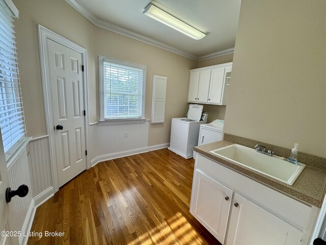 144 Woodhill Rd, Bardstown, KY 40004 - washroom with washing machine and dryer, wood finished floors, ornamental molding, cabinet space, and baseboards