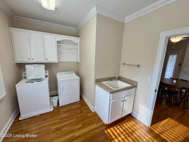 144 Woodhill Rd, Bardstown, KY 40004 - laundry area with a sink, wood finished floors, washer and clothes dryer, crown molding, and baseboards