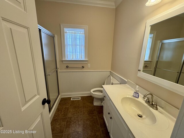 144 Woodhill Rd, Bardstown, KY 40004 - bathroom with a shower stall, toilet, vanity, a wainscoted wall, and ornamental molding