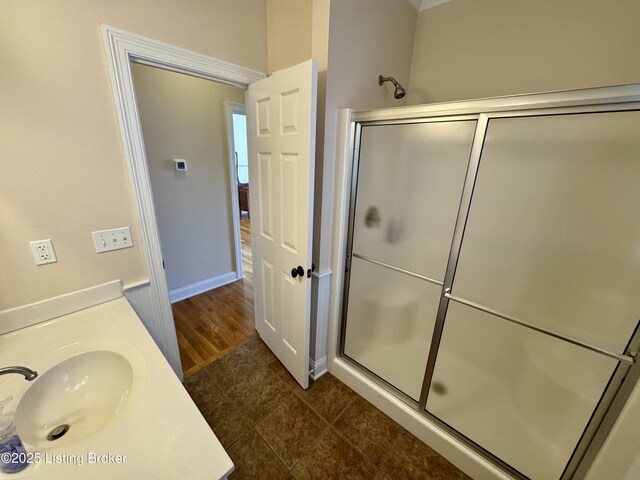 144 Woodhill Rd, Bardstown, KY 40004 - full bathroom featuring an enclosed shower, vanity, baseboards, and tile patterned floors