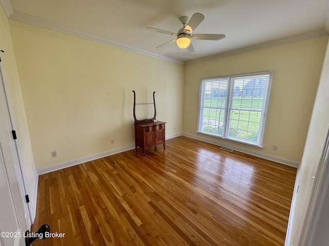 144 Woodhill Rd, Bardstown, KY 40004 - unfurnished room with wood finished floors, baseboards, ornamental molding, and ceiling fan