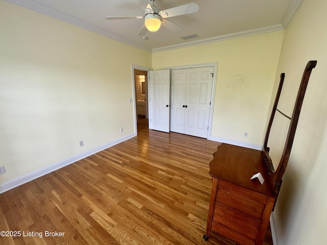 144 Woodhill Rd, Bardstown, KY 40004 - unfurnished bedroom with light wood-style floors, ornamental molding, baseboards, a closet, and a ceiling fan