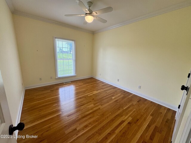 144 Woodhill Rd, Bardstown, KY 40004 - unfurnished room with wood finished floors, crown molding, baseboards, and ceiling fan