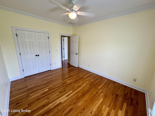 144 Woodhill Rd, Bardstown, KY 40004 - unfurnished bedroom with ornamental molding, wood finished floors, baseboards, a closet, and ceiling fan