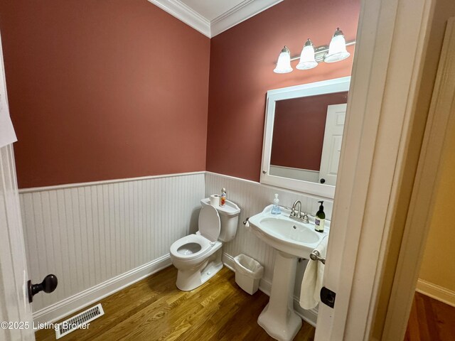 144 Woodhill Rd, Bardstown, KY 40004 - half bathroom with toilet, wood finished floors, ornamental molding, and a wainscoted wall