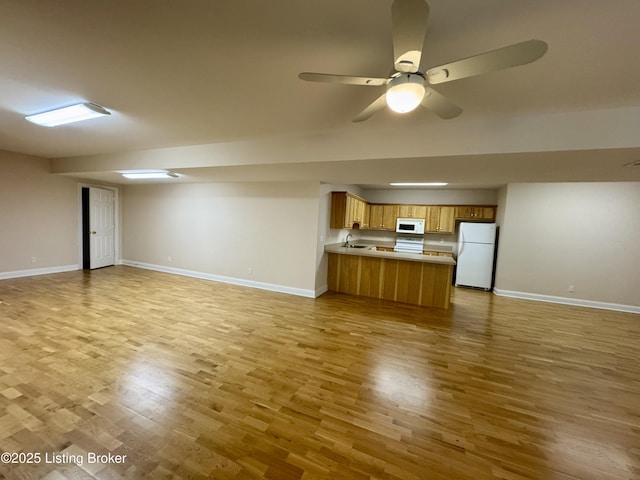 144 Woodhill Rd, Bardstown, KY 40004 - unfurnished living room with light wood-style flooring, ceiling fan, and baseboards