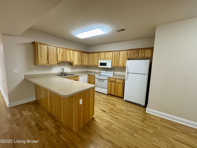 144 Woodhill Rd, Bardstown, KY 40004 - kitchen featuring white appliances, a sink, a peninsula, light wood finished floors, and baseboards