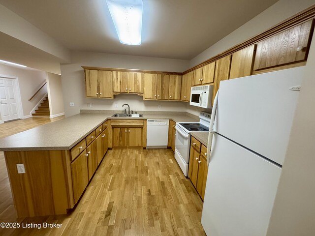144 Woodhill Rd, Bardstown, KY 40004 - kitchen with white appliances, a sink, light wood-style floors, a peninsula, and light countertops