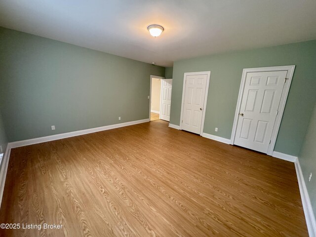 144 Woodhill Rd, Bardstown, KY 40004 - unfurnished bedroom with wood finished floors and baseboards