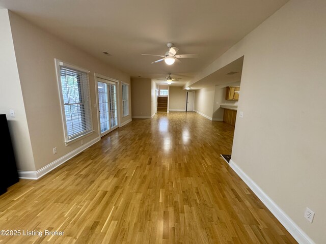 144 Woodhill Rd, Bardstown, KY 40004 - unfurnished living room with ceiling fan, light wood-style flooring, and baseboards