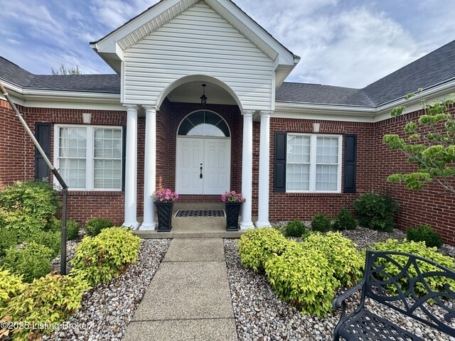 144 Woodhill Rd, Bardstown, KY 40004 - view of exterior entry featuring brick siding and roof with shingles