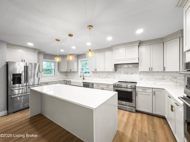 101 Harry Rucker Rd, Bardstown, KY 40004 - kitchen featuring appliances with stainless steel finishes, decorative backsplash, a kitchen island, light countertops, and recessed lighting