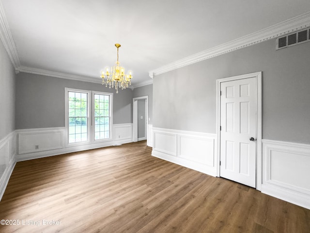 101 Harry Rucker Rd, Bardstown, KY 40004 - spare room featuring a chandelier, a wainscoted wall, wood finished floors, and crown molding