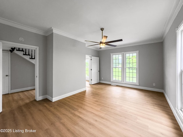 101 Harry Rucker Rd, Bardstown, KY 40004 - spare room featuring ceiling fan, light wood-type flooring, baseboards, ornamental molding, and stairs