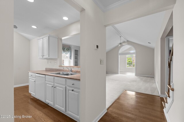 10106 Blossom Tree Way, Louisville, KY 40241 - kitchen featuring dishwasher, a sink, white cabinetry, baseboards, and light wood-type flooring