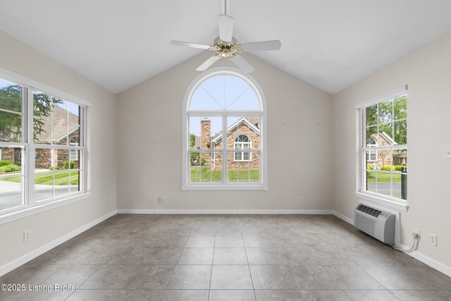 10106 Blossom Tree Way, Louisville, KY 40241 - empty room featuring plenty of natural light, a wall mounted air conditioner, vaulted ceiling, and baseboards