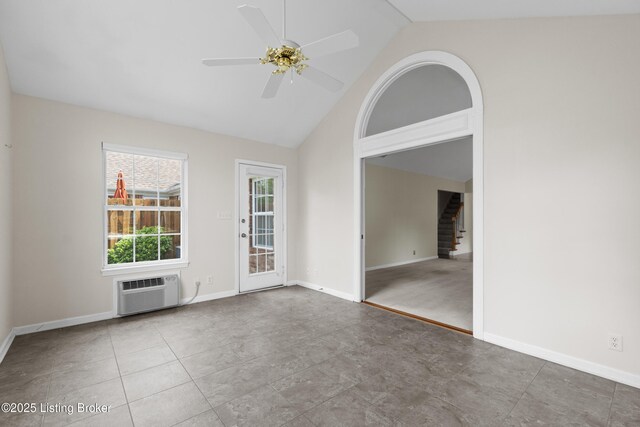 10106 Blossom Tree Way, Louisville, KY 40241 - empty room with a wall unit AC, a ceiling fan, stairway, baseboards, and high vaulted ceiling
