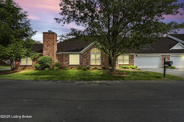 10106 Blossom Tree Way, Louisville, KY 40241 - view of front of house featuring driveway, a chimney, an attached garage, and a lawn