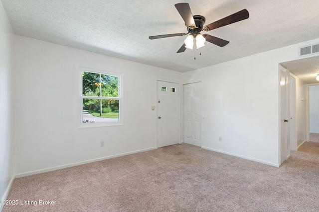 5612 Oakridge Pl, Louisville, KY 40229 - empty room with a textured ceiling, carpet, and baseboards