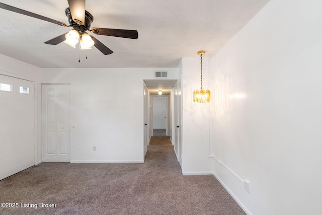 5612 Oakridge Pl, Louisville, KY 40229 - carpeted spare room featuring a ceiling fan, a chandelier, and baseboards