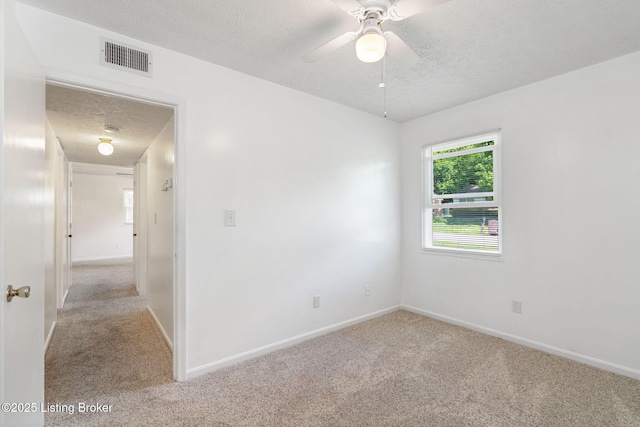 5612 Oakridge Pl, Louisville, KY 40229 - empty room with carpet flooring, a textured ceiling, baseboards, and a ceiling fan